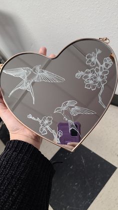 This is a hand-etched glass mirror showing two sparrows and some cherry blossom flowers. The mirror has a rose gold heart-shaped frame. Made with love by a professional tattoo artist out of Colorado who would greatly appreciate your support! This item would look adorable in any space or make a great gift for someone you love! One-of-a-kind. Mirror Engraving Ideas, Dremel Mirror Etching, Art On Mirror, Engraving Gifts, Mirror Etching, Mirror Etching Designs, Etched Glass, Glass Etching Art, Mirror Engraving