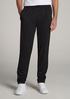 About Our Tall Men's Pants These men's tall athletic pants are a classic take on an athleisure essential. When it comes to athleisure, a good fit is key. You need something that's comfortable enough to relax in yet capable enough to work out in – but as a tall guy, it can be hard to find options that work for your height. You either have to compromise on a baggy fit or settle for lengths that are way too short. Not anymore. We know how hard it is to find quality styles when you're tall, which is Black Tapered Leg Sweatpants For Gym, Black Relaxed Fit Activewear With Straight Leg, Casual Training Pants With Pockets, Black Straight Leg Sportswear Pants, Black Sweatpants With Side Pockets For Gym, Black Relaxed Fit Straight Leg Activewear, Black Moisture-wicking Straight Leg Pants, Black Relaxed Fit Pants For Gym, Sporty Solid Moisture-wicking Pants