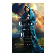 a book cover for a light on the hill by connie cossette with an image of a woman in blue