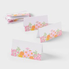 three folded cards with flowers on them