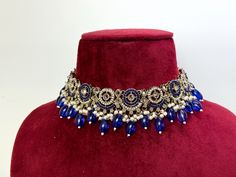 High quality royal blue and white Indian choker set with matching earrings. ------------------------------------------------------------------------------ ♡ SPECIAL PRICING ♡   Buy 2 or more items and get free delivery anywhere in Canada. Free US delivery for orders over $35 USD ♡ WEBSITE ♡  Shop directly on our website for more deals  www.TheJewelBlitz.com  ------------------------------------------------------------------------------ ♡ SHIPPING ♡   All of our orders come with tracking and are Traditional Blue Festive Choker, Blue Kundan Necklace For Celebration, Blue Stone Work Jewelry For Celebration, Blue Bollywood Necklace As A Gift, Festive Blue Kundan Bridal Necklace, Blue Tilla Temple Jewelry Bridal Necklace, Blue Kundan Necklace For Diwali Wedding, Blue Kundan Necklace For Wedding And Diwali, Blue Bollywood Bridal Necklace For Festivals