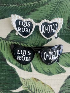 three sunglasses with the words louis rubi written on them