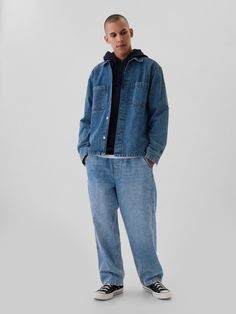 Fit: Sits below the waist with a longer rise.  Baggy through the hip & thigh.  Loose, slightly tapered leg.  Fabric: 13 oz 369 g) rigid denim.  Stretch: No Stretch.  Authentic rigid denim that gets better with every wear.  Made to wear all day & break in over time.  Look: A pull-on baggy jean in a light wash.  Details: Pull-on waist with drawcords, front & back pockets.  Responsibly Made: This pair of jeans is made with 5% recycled cotton and is part of our water-saving Washwell program.  Compared with conventional wash methods, Washwell uses at least 20% less water and has saved over a billion liters of water since 2016.  Our Mid Rise Jean has a 12. 75″ 32 cm) rise.  ​​ Sits below the waist with a longer rise.  Baggy through the hip & thigh.  Loose, slightly tapered leg.  ​​ Longer inseam Urban Denim Bottoms With Straight Hem, Light Wash Straight Hem Bottoms For Streetwear, Denim Blue Jeans With Welt Pockets For Everyday, Gap Washed Cotton Bottoms, Gap Cotton Streetwear Bottoms, Gap Casual Pants With Relaxed Fit, Gap Cotton Bottoms For Streetwear, Gap High Rise Relaxed Fit Jeans, Medium Wash Relaxed Fit Rigid Denim Jeans