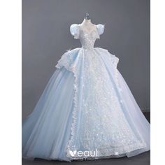 a white and blue wedding dress on display