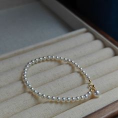 Embrace timeless grace with our Dainty Pearl White Freshwater Bracelet. Featuring delicate 4-5mm pearls, this bracelet captures a classic elegance that's both subtle and enchanting. Perfectly strung to rest effortlessly on your wrist, the small-sized pearls provide a refined touch that's suitable for any occasion. Whether worn alone or paired with other pieces, this dainty bracelet embodies pure sophistication. It's a beautiful reminder that true elegance often lies in simplicity. Pearl size 4-5 Dainty White Pearl Luxury Bracelet, White Pearl Bracelet In 14k Gold Filled, Delicate Style, Dainty 14k Gold-filled Pearl Bracelet, Elegant Yellow Gold 14k Gold-filled Pearl Bracelet, White 14k Gold-filled Pearl Drop Bracelets, Pearl Bracelet Jewelry, Gold Pearl Bracelet, 18k Gold Bracelet, Pearl Bracelets