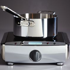 a silver pan sitting on top of an electronic device