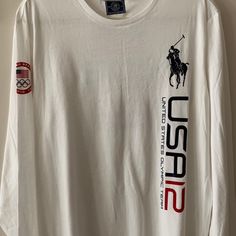 a white long - sleeved shirt with the word usa on it