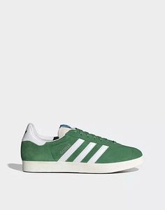 adidas Originals Gazelle sneakers in green and white | ASOS Green Mid-top Sneakers With Boost Midsole, Green Mid-top Sneakers For Streetwear, Green High-top Sneakers With Gum Sole For Streetwear, Green High-top Skate Shoes With Rubber Sole, Green Sporty Skate Shoes With Gum Sole, Green Mid-top Sporty Sneakers, Custom Green Adidas Sneakers, Green Sneakers With Boost Midsole, Green Sporty Sneakers With Boost Midsole