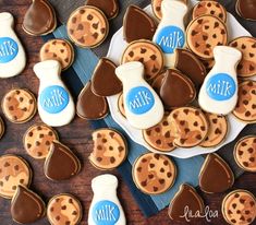 cookies decorated with milk and chocolate are on a plate