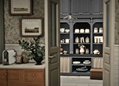 an open door leading to a kitchen filled with lots of counter tops and cupboards