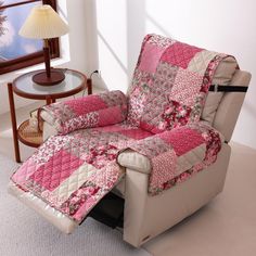 a living room with a recliner chair covered in pink and white quilted fabric