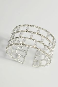 Introducing the Luminous Lattice Cuff Bracelet, a breathtaking creation designed to capture the spotlight. This bracelet features a unique lattice design, meticulously adorned with rows of sparkling rectangular and round-cut crystals that shimmer with every movement. Crafted with a flexible cuff style, it offers a comfortable fit while making a bold fashion statement. Ideal for glamorous evenings or as a luxurious gift, this piece promises to enchant and elevate any ensemble with its radiant ele Cuff Bracelet Silver, Elegance Fashion, Lattice Design, Silver Cuff Bracelet, Bracelet Silver, Cuff Bangles, Bold Fashion, Lattice, Cuff Bracelet