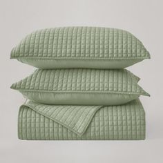 three pillows stacked on top of each other