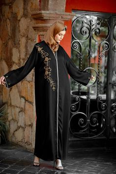 Premium Khaleeji Edition Open Abaya The Black Beaded Button Down Open Front Abaya is sophisticated and graceful! Featuring high quality nida fabric with perfectly placed beading on the chest and arms. You will be looking for an excuse to wear this beautiful abaya. Team it up with one of our dresses. 100% Nida Fabric Beaded Detailing Button Down Model is 5'5" and wearing size S Maternity Friendly Nursing Friendly Elegant Long Abaya With Dabka Work, Elegant Embroidered Formal Thobe, Formal Abaya With Dabka Work For Eid, Formal Floor-length Embroidered Abaya, Elegant Embroidered Floor-length Abaya, Formal Eid Abaya With Dabka Work, Embellished Long Sleeve Thobe For Eid, Embellished Floor-length Abaya For Eid, Open Abaya