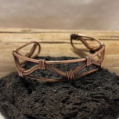 Handcrafted bracelet made with pure copper. Twisted by hand and shaped to fit your wrist. Unique Copper Wire Cuff Bracelet Gift, Adjustable Brown Copper Braided Bracelets, Hand Wrapped Copper Cuff Bracelet Gift, Handmade Rose Gold Copper Cuff Bracelet, Spiritual Bronze Copper Cuff Bracelet, Handmade Copper Wire Cuff Bracelet Bangle, Handmade Copper Braided Bangle Bracelet, Handmade Copper Wire Cuff Bangle, Adjustable Bronze Copper Bracelets