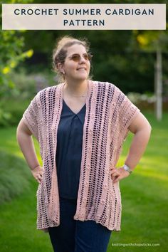 a woman standing in the grass with her hands on her hips and wearing a pink crochet summer cardigan pattern