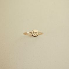 Embrace timeless elegance with our Birth Flower Ring, where traditional charm meets personalized flair. Crafted in 14k gold filled, this meaningful piece can be tailored with a hand-stamped birth flower. Carry a token of cherished memories with you wherever you wander, securely encircling your finger. Handcrafted in the U.S.A Details Hypoallergenic, Water Resistant, Tarnish-free Material : 14k Gold Filled Flower Stamp 4mm Note: If your size is a half ex: 5 1/2, leave us a note at the cart reques 40th Gifts, 20 Gifts, Flower Stamp, 30 Gifts, Beaded Cuff, Birth Flower, Birth Flowers, Chain Choker, Cherished Memories