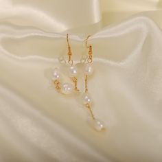 Discover the modern sophistication of Pearl Drop Threader Earrings, elegantly designed in 18k gold plating. These earrings feature a sleek threader design with a lustrous pearl drop, perfect for a refined look. Elegant Drop Pearl Earrings In 14k Gold Filled, Elegant Threader Earrings For Party, Minimalist Pearl Dangle Linear Earrings, 14k Gold Filled Drop Pearl Earrings With Pearl Pendant, Gold Long Drop Earrings With Pearl Pendant, 14k Gold-filled Pearl Drop Earrings With Pendant, Gold Long Drop Pearl Pendant Earrings, Elegant Pearl Charm Earrings In 14k Gold Filled, Elegant White Drop Threader Earrings