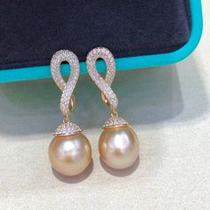 This South Sea pearl earring has carefully selected about 11mm South seawater gold pearls. Near round slightly flawed extremely strong light sterling silver earrings, finely crafted sterling silver accessories, luxurious inlays. The color is nice and the surface is translucent.Our Pearl Accessory Collection are all 100% Genuine pearls. We only source the best quality materials for our pearl accessories.Description:Materials: 925 Sterling Sliver plated with 18k GoldGemstone: Pearl、Cubic ZirconiaW Luxury Pearl Pendant Round Earrings, Luxury Round Pearl Pendant Earrings, Luxury Pearl Pendant Earrings, Luxury High Luster Sterling Silver Earrings, Luxury Pearl White Sterling Silver Pearl Earrings, Gold Sterling Silver Round Pearl Earrings, Exquisite Silver Earrings With High Luster, Gold Sterling Silver Pearl Earrings, Yellow Gold Pearl Pendant Earrings In Sterling Silver