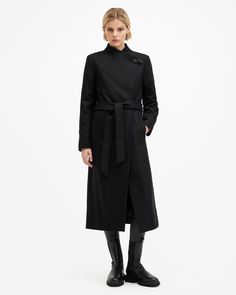 This coat is designed to a regular fit that is true to size Button and clasp lock closure Long sleeves Below knee length Funnel neck Self-tie belt Two pockets One interior pocket Recycled fabrics Italian cloth – woven in Prato, Italy.