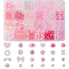 an assortment of pink and white beads in a plastic container with hearts, stars, bows, and more