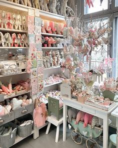 a room filled with lots of different types of shoes and other items on shelves next to each other