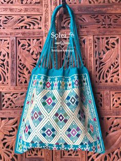 "This gorgeous embroidered Mexican Satchel or Morral is perfect to style with any outfit! The traditional Mexican embroidery is full of culture and colors. This Bag is embroidered on a waist loom. Dimensions: 15.5\" x 15.5\"" Blue Rectangular Shoulder Bag For Festivals, Blue Embroidered Bag For Daily Use, Handmade Blue Shoulder Bag For Festivals, Blue Rectangular Festival Bag, Traditional Bags With Floral Embroidery For Daily Use, Embroidered Blue Rectangular Shoulder Bag, Traditional Multicolor Bag With Floral Embroidery, Traditional White Shoulder Bag With Handwork, Blue Embroidered Bag For Festivals