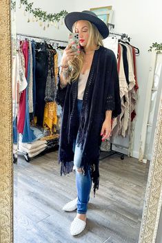 Looking for a stylish and fun way to stay warm this winter? This cute and cozy wrap is perfect for chilly days and nights, and can be dressed up or down to suit any occasion! #lovemyleto 100% Acrylic Imported Bohemian Knit Cardigan For Fall, Bohemian Winter Cardigan, Trendy Winter Festival Outerwear, One Size Fringe Cardigan For Fall, Black Bohemian Knit Outerwear, Bohemian Black Knit Outerwear, Long Fall Outerwear With Tassels, Spring Bohemian Knit Outerwear, One Size Long Sleeve Poncho For Cold Weather