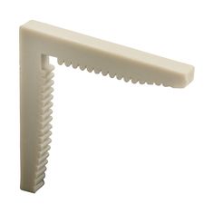 a close up of a white plastic object on a white background with clippings