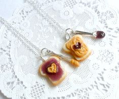 This is a pair of peanut butter and jelly heart necklaces.. one for you and one for your bff! :) Handmade by me with polymer clay. And they have little pewter knife and spoon charms on each necklace that have some 'peanut butter' & 'jelly' on them. :) Choose either silver plated, gold plated, surgical stainless steel, or sterling silver chain (stainless steel and sterling silver are especially good for those with metal sensitivities). The pictures show the sterling silver chain. :) **As thes Jelly Hearts, Bff Necklace, Butter Honey, Bff Jewelry, Home Id, Peanut Butter And Jelly, Friend Bff, Bff Necklaces, Peanut Butter Jelly