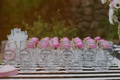 many glasses are lined up on a table