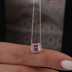 The "14K Gold Emerald Cut Pink Tourmaline Necklace" is a breathtaking piece of jewelry that radiates beauty and elegance. Adorned with a delicate pink emerald halo, this necklace exudes charm and sophistication. Perfect for Mother's Day or as a wedding gift, it symbolizes love, compassion, and femininity. With its dainty design and genuine 14K gold construction, this necklace is sure to be treasured as a timeless and meaningful accessory. Pendant Width: 0.37 inches / 9.40 mm Pendant Height: 0.30