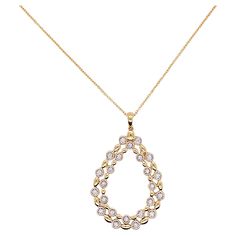 This pear shaped necklace is a gorgeous statement on any neck! The double pear is an open design that has 24 glorious diamonds that are bezel set and alternate with a lovely gold bead. The pendant is flat but 1 5/8 inches long. A drop diamond or gemstone could be added to the center of the pendant if you had a gemstone that you wanted to mount in a pendant. Such a graceful jewelry item! Material: 14K Gold Diamond Count: 24 Diamond Weight: .16 carats Diamond Clarity: VS-2 Diamond Color: G-H Measu Anniversary Rose Cut Diamond Teardrop Pendant Necklace, Anniversary Teardrop Pendant Necklace With Rose Cut Diamonds, Elegant Pear-shaped Yellow Gold Drop Necklace, Yellow Gold Teardrop Necklace With Rose Cut Diamonds, Teardrop Diamond Necklace With Rose Cut Diamonds For Anniversary, Teardrop Rose Cut Diamond Necklace For Anniversary, Formal Teardrop Necklace With Rose Cut Diamonds, Yellow Gold Pear-shaped Necklace With Rose Cut Diamonds, Formal Rose Cut Diamond Teardrop Necklace