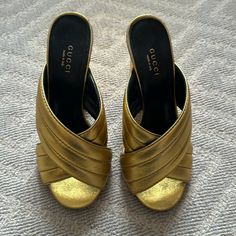 Gucci Gold Webby Cross Over Sandals. Please Note Condition In Photos. Size 37. Heel Is 4.25. Luxury Closed Toe Mules With 4-inch Heel, Designer Gold Sandals With Heel Loop, Designer Gold Sandals With Wrapped Heel, Luxury Gold Open Heel Mules, Luxury Gold Mules With Padded Heel, Gold Open Heel Mules With Heel Loop, Designer Gold High Heel Mules, Designer Gold Mules With Padded Heel, Designer Gold Mules For Party