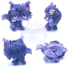 four little purple dolls with big eyes and horns on their heads, all in different poses