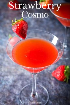 the strawberry cosmo cocktail is garnished with strawberries