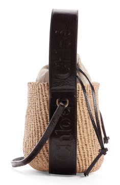 Elevate your warm-weather look with this compact basket bag designed with a drawstring lining and a leather version of the logo-embellished Woody strap. Drawstring closure Top carry handle; crossbody strap Lined Paper straw with leather trim Made in Italy Designer Handbags This brand has B Corp certification, representing business practices with emphasis on social and environmental performance, accountability and transparency This brand meets Nordstrom Responsible Brands criteria: brand adheres Designer Bucket Bag With Leather Trim, Luxury Straw Bag With Leather Trim And Top Handle, Designer Summer Bucket Bag For Everyday, Designer Brown Bucket Straw Bag, Designer Straw Bucket Bag With Leather Handles, Leather Trim Bucket Bag For Shopping, Bucket Bag With Leather Trim For Shopping, Luxury Leather Summer Bucket Bag, Designer Straw Bucket Bag With Braided Handles