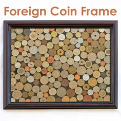 a wooden frame filled with coins and the words foreign coin frame