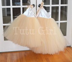 "Classic and beautiful, our one strap style tutu dress is made in a mix of ivory and our champagne/beige skirt. The top of the dress is FULLY LINED and the top of the strap opens to tie with a matching ribbon strap which ties at the right shoulder. The back of the dress is stretchy elastic along the top hem. We can make this dress in literally any color skirt (or even a mixture of colors). Convo us for questions. WANT A SEWN IN SLIP TO LINE THE TUTU? https://www.etsy.com/listing/125566641/add-a- Elegant Cream Tutu Dress For Dress-up, Cream Tulle Tutu Dress For Bridesmaids, Cream Tulle Tutu Bridesmaid Dress, Cream Tulle Bridesmaid Tutu Dress, Elegant Cream Tutu Dress For Summer, Elegant Cream Summer Tutu Dress, Elegant Summer Cream Tutu Dress, Spring Cream Tutu Dress In Tulle, Cream Tulle Tutu Dress For Wedding