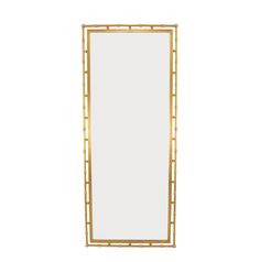 a tall mirror sitting on top of a white wall