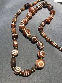 Vintage Agate Beaded Necklace With Large Beads, Vintage Brown Agate Beaded Necklace, Vintage Brown Agate Beaded Necklaces, Vintage Agate Beaded Necklaces With Large Beads, Vintage Brown Agate Necklace, Brown Vintage Agate Necklace, Carnelian Amulet Necklace With Round Beads, Bohemian Amber Polished Beads, Brown Amulet Necklaces With Large Beads