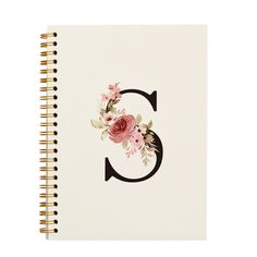 a spiral notebook with the letter g decorated with pink flowers and greenery on it