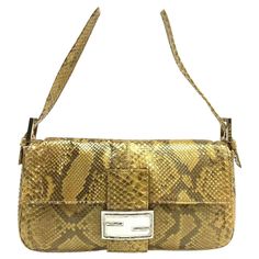 Fendi Baguette Brown Python Leather Snake Print These are professional photos of the actual bag offered by Luxbags. Fendi Baguette Brown Python Leather with Snake Print. This designer bag is the perfect combination of sophisticated style and craftsmanship. The Fendi Baguette Brown Python Leather with Snake Print is made from premium materials and features a unique snake print design that stands out from the crowd. Very good condition. Missing enamel on the front buckle. Python leather is a littl Snake Bag, Bottega Veneta Cassette, Fendi Shoulder Bag, Hermes Kelly Bag, Professional Photos, Python Print, Fendi Baguette, Shopping Photography, Designer Shoulder Bags