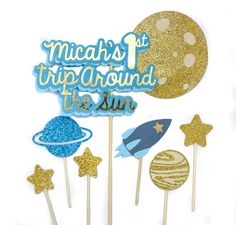 there is a cake topper that says micah's trip around the sun