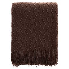 a brown blanket with fringes on it