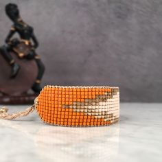 Unique Hand-strung Adjustable Friendship Bracelets, Adjustable Orange Bracelet Wristband, Adjustable Orange Wristband Bracelet, Handmade Friendship Bracelets With Round Beads, Unique Adjustable Bracelet With Faceted Beads, Adjustable Bracelets With Faceted Beads, Handmade Adjustable Friendship Bracelets With Round Beads, Orange Beaded Friendship Bracelets As Gift, Handmade Orange Beaded Bangle Bracelets