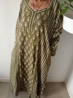 This Item is handmade. The fabric used is top quality cotton to ensure your skin is pampered and always natural. It is beautifully painted on with blocks- a traditional Indian style of printing.Each layered block by block,colour by colour, creating an exquisite design. The design is multi functional depending on your mood, Use it like a kaftan to lounge around the house in or even as a swim cover up for your day at the beach or pool. The second item and consecutive items of the same order are US Bohemian Kaftan Tunic For Beach, Long Batik Print Kaftan For Spring, Long Spring Kaftan With Batik Print, Casual Long Sleeve Kaftan For Loungewear, Bohemian Long Sleeve Kaftan For Summer, Oversized Bohemian Cotton Maxi Dress, Long Kaftan With Batik Print For Spring, Beige Cotton Kaftan For Spring, Long Sleeve Boho Dress For Beach