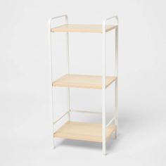 a white shelf with two shelves on each side