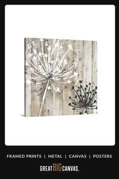 a white and black painting on wooden planks with flowers in the center, surrounded by text that reads framed prints metal canvass posters great big canvases