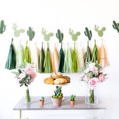 the dessert table is decorated with cactus decorations